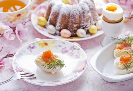 Easter cake and  eggs with salmonの写真素材