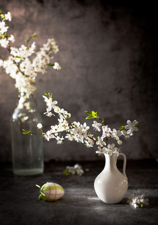 blossom apple tree in vase on dark backgroundの写真素材