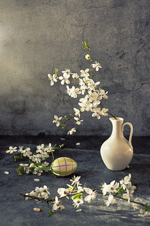 blossom apple tree in vase on dark backgroundの写真素材