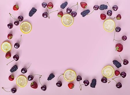 Top view of round frame made of summer fruitsの写真素材