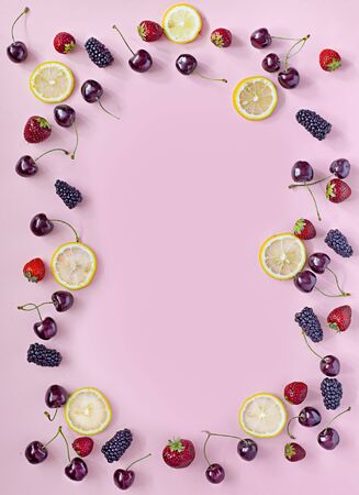 Top view of round frame made of summer fruitsの写真素材