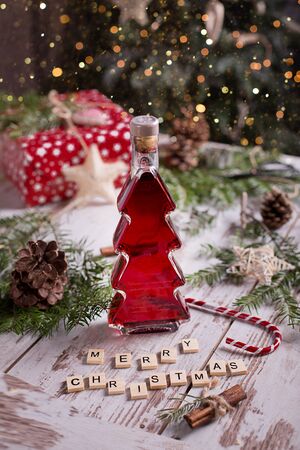 red wine in a Christmas tree-shaped bottleの写真素材