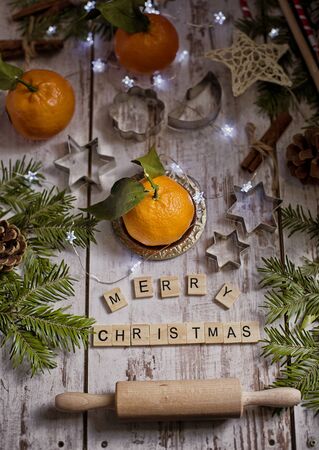 Christmas decoration with mandarins,cookies,berries and spicesの写真素材
