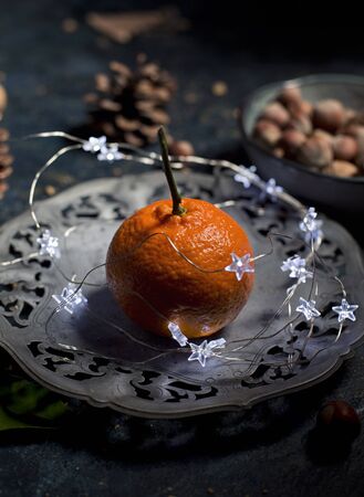 Christmas decoration with mandarins,cookies,berries and spicesの写真素材