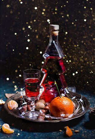 red wine in a Christmas tree-shaped bottleの写真素材