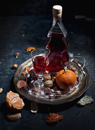 red wine in a Christmas tree-shaped bottleの写真素材