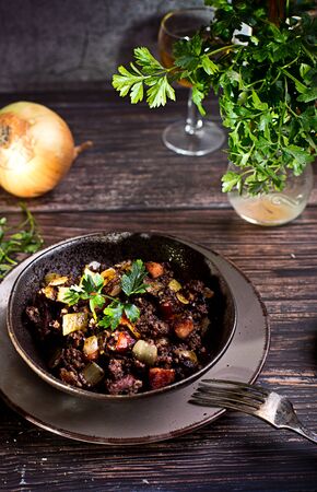 blood sausage with onion and parsleyの写真素材