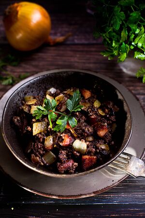 blood sausage with onion and parsleyの写真素材