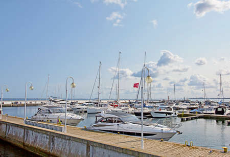 SOPOT, POLAND - october 13, 2020: Sail boats and yachts docked at the marina (harbor) in the Pier Molo, the longest wooden pier in Europe, at the baltic sea.のeditorial素材