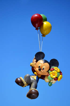 Monchique, Faro - Portugal, 17, April 2013. Studio image of a Mickey Mouse resin figure floating in...