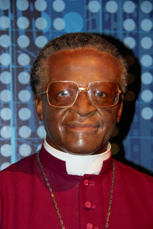 London, - United Kingdom, 08, July 2014. Madame Tussauds in London.  Waxwork statue of Desmond Tutu. Created by Madam Tussauds in 1884, Madam Tussauds is a waxwork museum and tourist attractionのeditorial素材