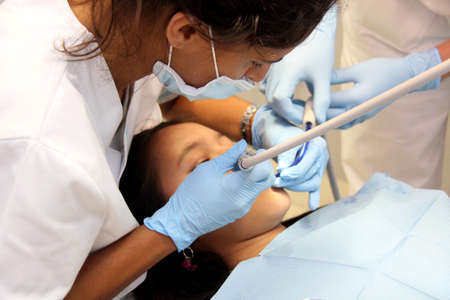Monchique, Algarve, Portugal. Circa June 2015. Young client having dental work done in a modern dental clinic In  a mountain town in Monchique, Algarve.のeditorial素材