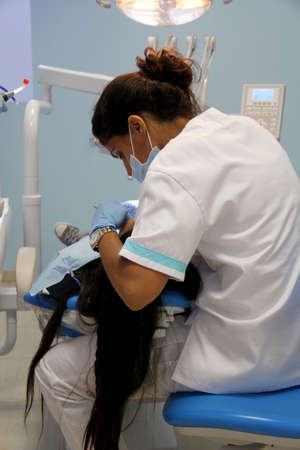 Monchique, Algarve, Portugal. Circa June 2015. Young client having dental work done in a modern dental clinic In  a mountain town in Monchique, Algarve.のeditorial素材