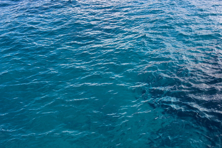Blue and transparent sea water texture pattern. Similan national park, Thailand. Artistic texture for marine themes. The material can be used as a backdrop for tourist destinations. Can be used as a background. View from above.の写真素材
