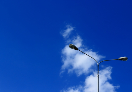 Lighting lamp, street lights, lamppost against the vast blue sky with cloud - abstract minimalism...