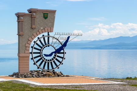 Kultuk, Irkutsk region, Russia - July 13, 2017: A sign marking the beginning of the Circum-Baikal railway on the background of the mesmerizing landscape Siberia in the early sunny summer morning.のeditorial素材