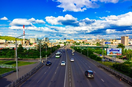 Krasnoyarsk, Russia - July 6, 2018: car traffic on a summer day in a city street. Top view from Kopylovsky Bridge to the road. Scenes of city life.のeditorial素材