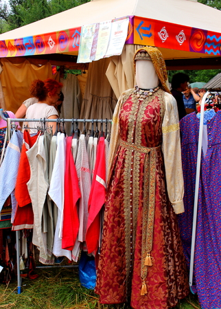 Shushenskoye, Russia - July 14, 2018: national Russian costume on market of annual International Festival of Music and Crafts World of Siberia (FestMirSibiri)のeditorial素材