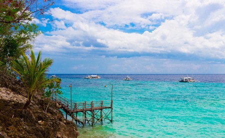 Artistic colorful style view idyllic tropical azure sea bay. Scenic exotic landscape with blue...