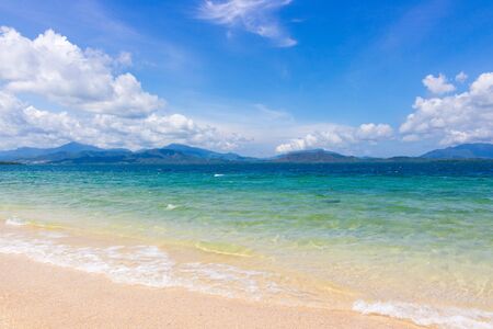 Luxury beach with azure water and cloudy sky. Concept background for tropical travel or summer exotic vacation. Philippine paradise beach.の写真素材