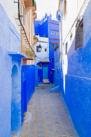 Empty narrow street in medina of Chefchaouen, Morocco. The walls of houses in the city are painted in shades of blue, light blue and indigo. The town is called the Blue Pearlの写真素材