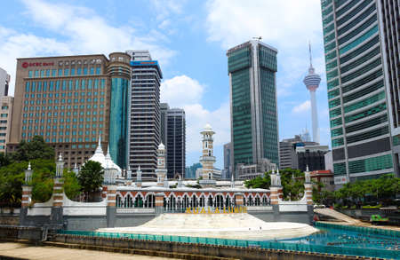 Kuala Lumpur, Malaysia - Mart 12, 2019: Modern cityscape with a Mosque Masjid Jamek on the...