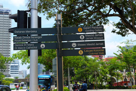 Kuala Lumpur, Malaysia - March 12, 2019: Tourist direction sign with arrows pointing to attractions on Merdeka Square or Independence Square in Kuala Lumpur cityのeditorial素材