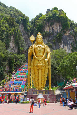 Kuala Lumpur, Malaysia - March 15, 2019: Giant golden statue of Lord of Murugan at Batu caves near Kuala Lumpur, Malaysia. Hindu god war and victory. Selective focusのeditorial素材