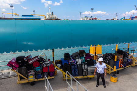 Tagbilaran, Bohol Island, Philippines - September 30, 2018: a suitcases and luggage on trolley waiting to unloading on sea pier to Bohol Islandのeditorial素材
