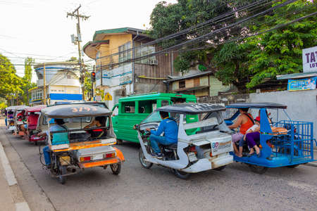 Puerto Princesa, Palawan island, Philippines - September 27, 2018: tricycle motorbikes on the road...