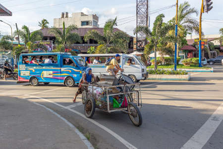 Puerto Princesa, Palawan island, Philippines - September 27, 2018: road traffic on Puerto Princesa...
