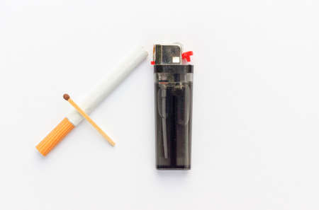Cigarette, match and lighter isolated on white background. View from aboveの写真素材