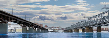 Winter view of the city bridges over the Yenisei river in Krasnoyarsk, Russia. Translation: Siberiaの写真素材