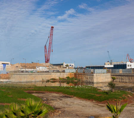 Casablanca, Morocco - 21 October, 2019: red construction crane in seaport in Casablancaのeditorial素材