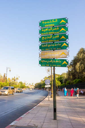 Marrakech, Morocco - 12 October, 2019: Directions board on the street of Marrakesh with arrows showing destinations to city tourist attractionsのeditorial素材