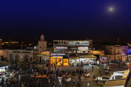 Marrakesh, Morocco - 12 October, 2019: street vendors and tourists in the Jemaa el-Fna square at night in Marrakesh, Morocco. Low light shootingのeditorial素材