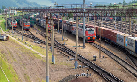Krasnoyarsk, Russia - June 20, 2021: cargo trains on complex railway station of Trans-Siberian...