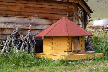 Wooden dog house in the form of a small yurtの写真素材