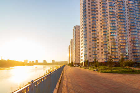 Krasnoyarsk, Russia - August 28, 2021: high-rise apartment building on the embankment of the Yenisei river at dawnのeditorial素材