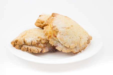 Sochen from shortcrust pastry with cottage cheese or curd in white plate isolated on white...