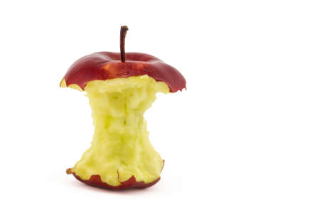 Isolated partially eaten red apple on white background with copy spaceの写真素材