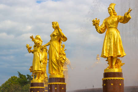 Moscow, Russia - 19 August, 2020: Fragment of the Friendship of Peoples fountain with golden statues at the Exhibition of achievements of national economy or VDNKh or VDNH in Moscow, Russiaのeditorial素材