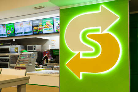 Krasnoyarsk, Russia - December 25, 2021: Exterior view and Subway logo. Subway is an American multi-national fast food restaurant franchise where do they sells submarine sandwiches, wraps, salads.のeditorial素材
