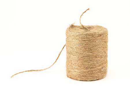 Skein of natural jute twine isolated on white background. Hemp threadの写真素材