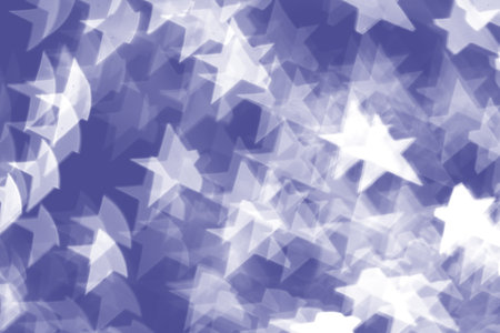 Stars light bokeh on Very Peri color background. Concept of Christmas and Happy New Year. Design elements with Very Peri trend color.の写真素材