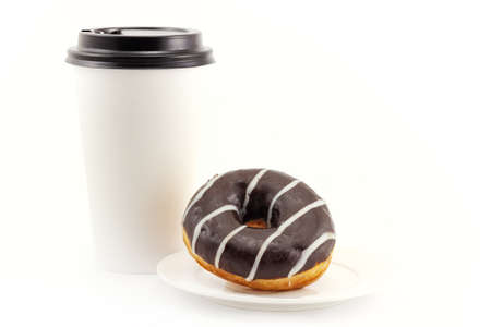 Chocolate donut on plate and blank disposable takeaway paper coffee cup isolated on a white...