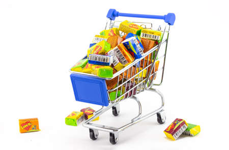 Krasnoyarsk, Russia - February 24, 2022: Shopping basket fully filled with chewing gum 'Love is'...