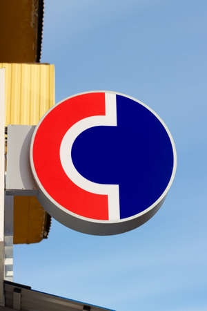 Krasnoyarsk, Russia - February 27, 2022: The logo of the Sovcombank above the entrance of one of its branch officesのeditorial素材