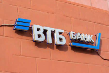 Krasnoyarsk, Russia - February 27, 2022: The logo bank of the VTB Bank above the entrance of one of its branch officesのeditorial素材