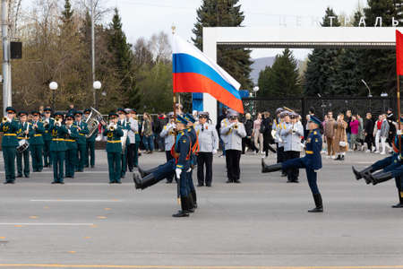 Krasnoyarsk, Russia - May 5, 2022: Soldiers in full dress march solemnly carry the Russian national...